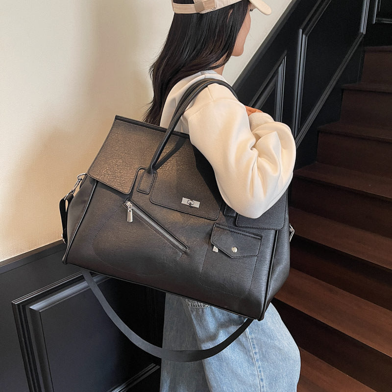 Person holding a black JOEY Large Faux Leather Multi-use Shoulder Tote Bag 