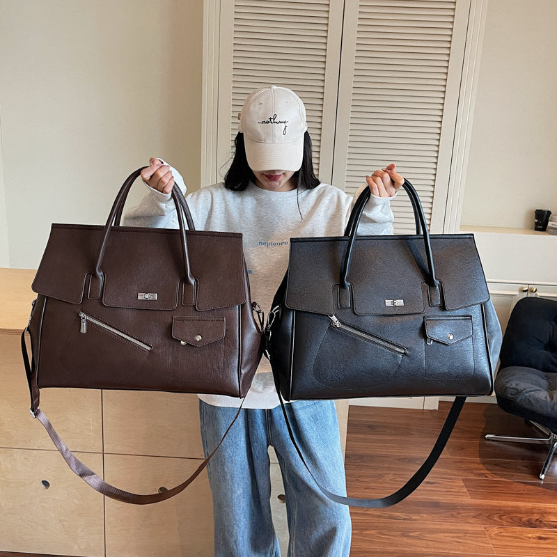 Person holding two JOEY Large Faux Leather Multi-use Shoulder Tote Bag in black and brown