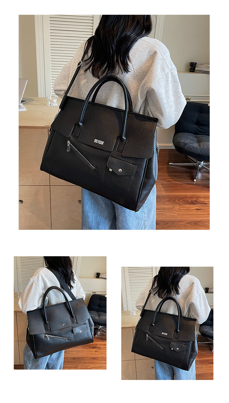 People holding a black JOEY faux leather tote bag
