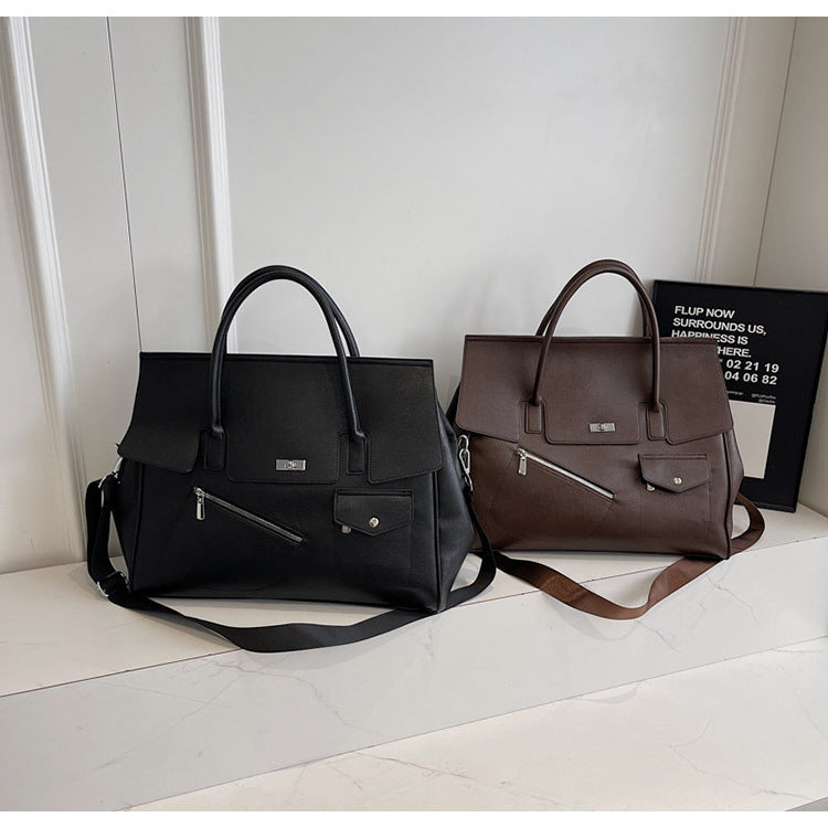 Two JOEY handbags, one black and one brown